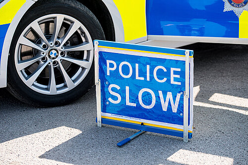 Police slow sign